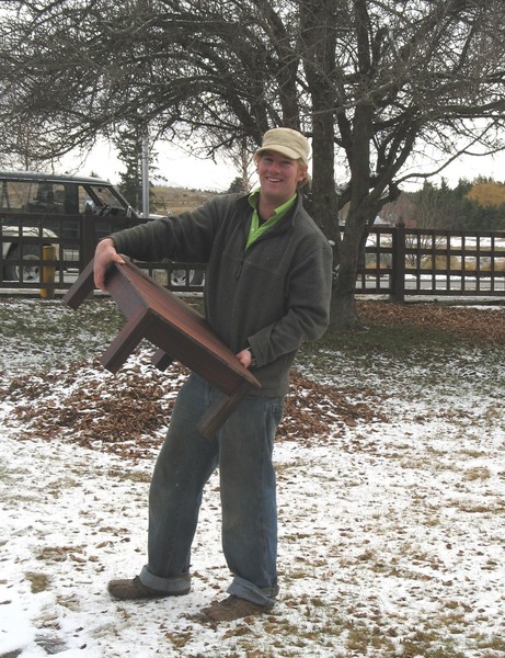  Local farmer Sam Simpson arriving with a piece of his woodwork, braving the winter elements
